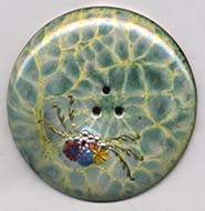 enameled button with paillons
